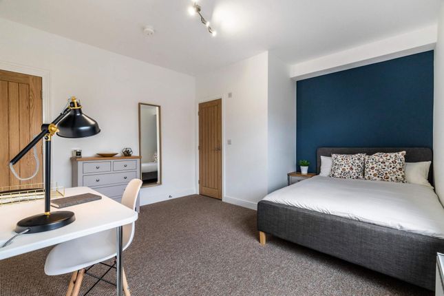 Bright, Modern Master Bedroom With A Comfortable d...