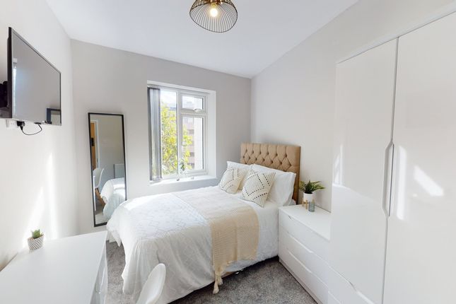 A Bright And Inviting Double Bedroom With Modern d...