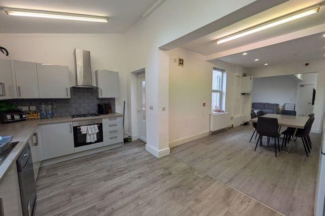 A Spacious And Well-Lit Contemporary Living Room W...