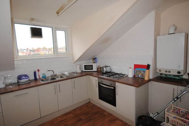 Bright And Functional Kitchen Area With Ample Coun...