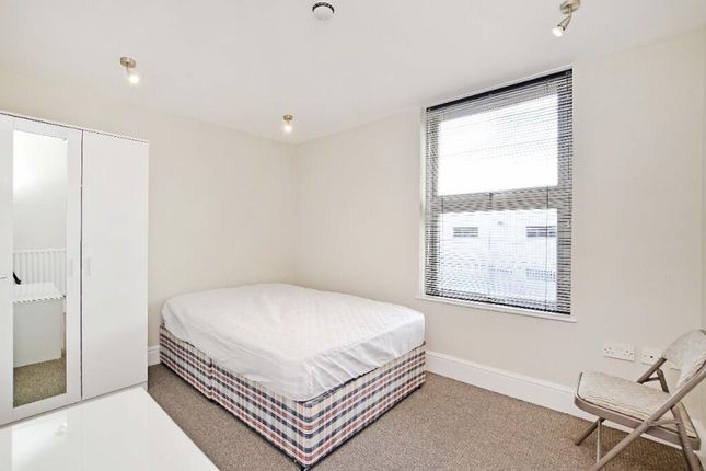 Bright And Clean Master Bedroom Featuring A Comfor...