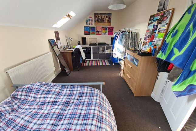 A Spacious And Bright Bedroom Featuring A Double B...