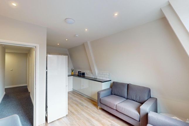 A Modern And Inviting Living Room With Ample Natur...