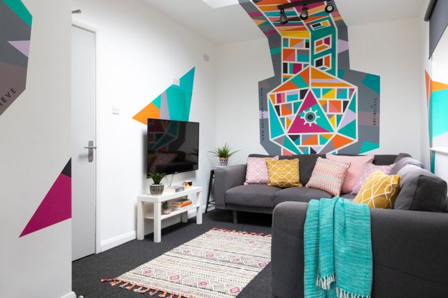 A Modern, Vibrant Living Room Featuring Colorful G...
