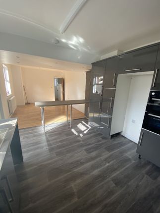 Modern Kitchen With Sleek Grey Cabinetry, Ample Na...