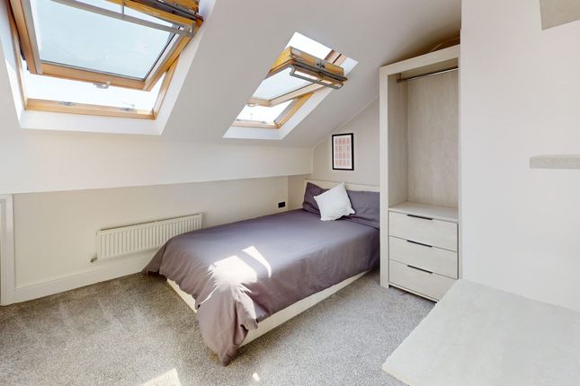 A Bright And Inviting Double Bedroom With Ample Na...