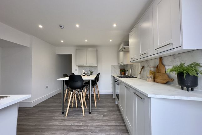 A Modern And Spacious Kitchen With Ample Natural l...