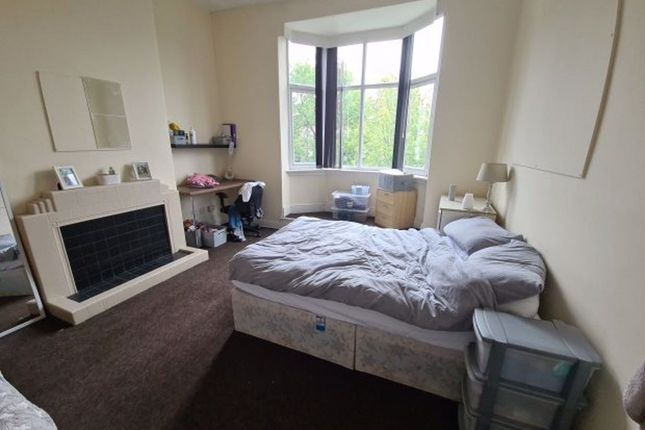 A Spacious Master Bedroom Featuring A Large Bay Wi...