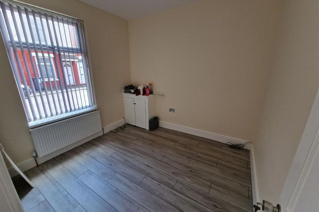 A Clean, Simple Single Bedroom Featuring A Large W...