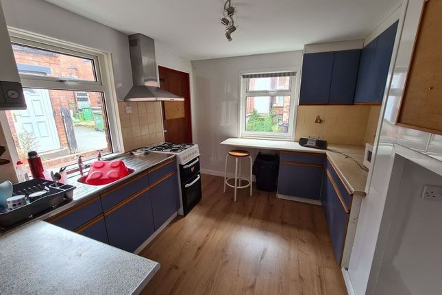 Bright And Modern Kitchen Featuring Ample Countert...