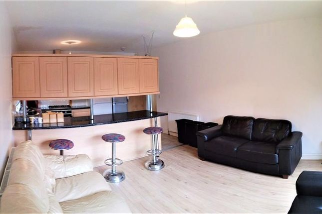 A Modern Living Room Featuring A Spacious Layout W...