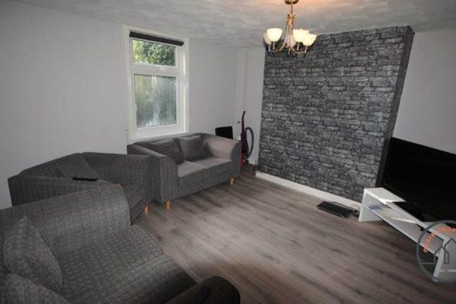 A Cozy Living Room Featuring Modern Grey Sofas, A ...