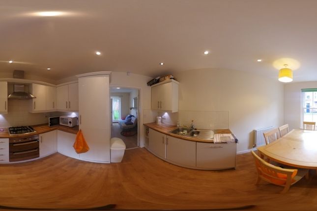 A Bright And Spacious Kitchen With Modern Applianc...