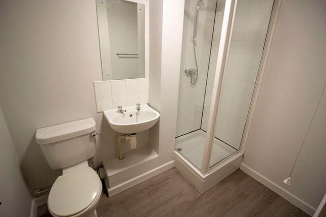 A Modern Bathroom Featuring A Sleek Shower, Minima...