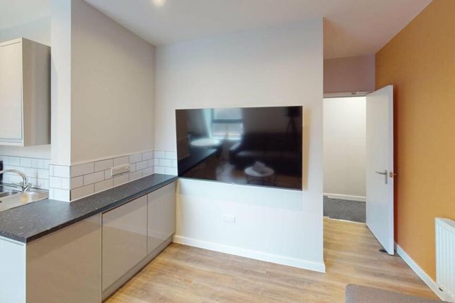 A Modern Kitchenette With Sleek Finishes And Ample...