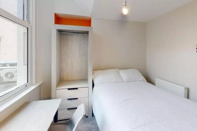 A Bright And Tidy Double Bedroom Featuring Modern ...
