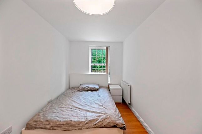 A Simple, Clean Single Bedroom With White Walls, A...
