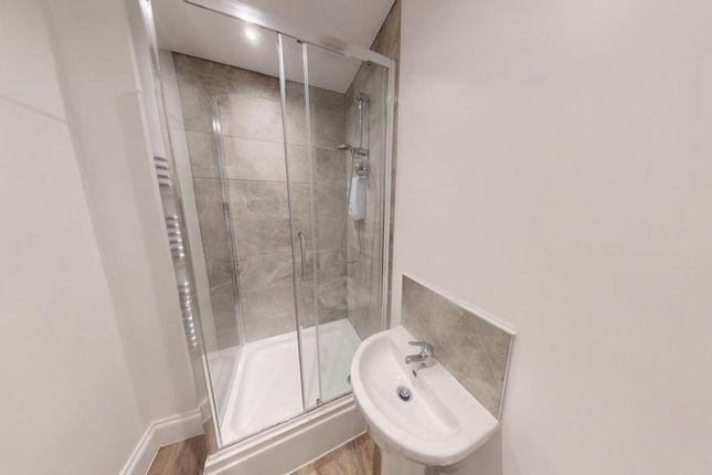 A Modern And Clean Bathroom Featuring A Spacious S...