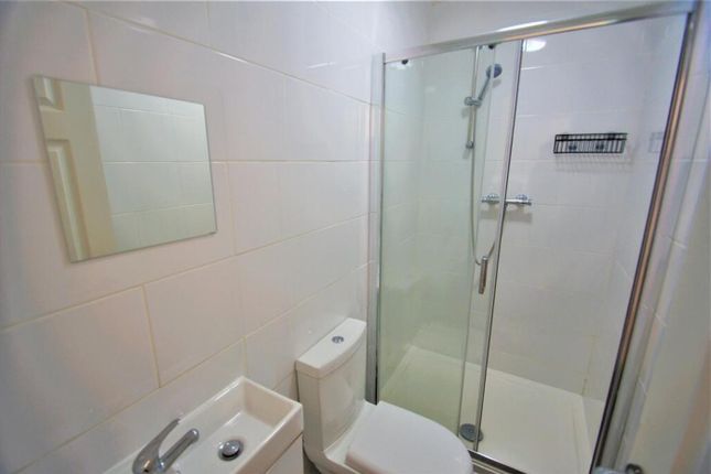 A Modern Bathroom Featuring A Sleek Shower, Contem...