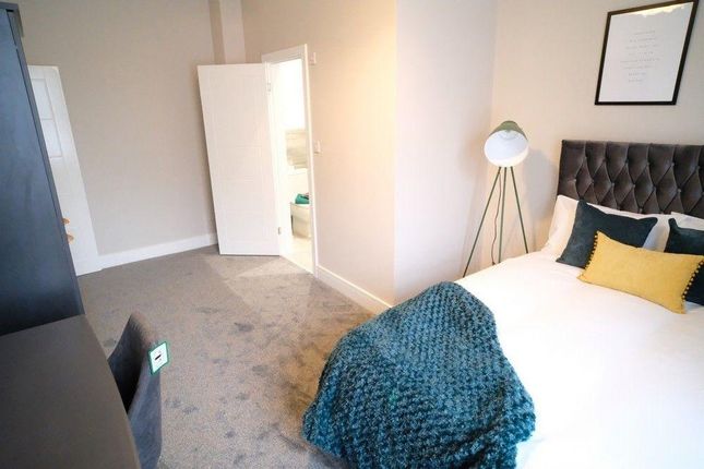 Bright And Inviting Master Bedroom Featuring A Com...