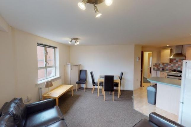 Bright And Welcoming Living Room Featuring Comfort...