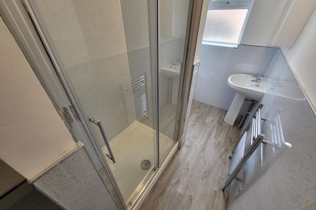 A Modern Bathroom Featuring A Sleek Glass Shower, ...