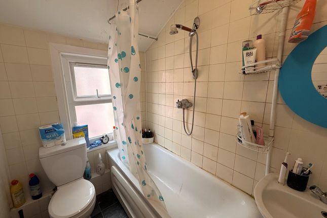 Compact Bathroom With A Shower-Over-Bath, Patterne...