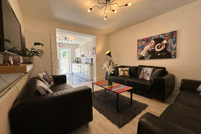 This Stylish Living Room Features Contemporary Dec...