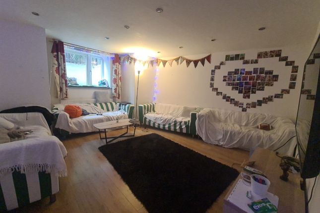 A Cozy Living Room Featuring Multiple Seating Opti...