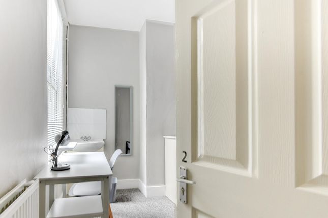 A Clean, Well-Maintained Bathroom With A Sink And ...