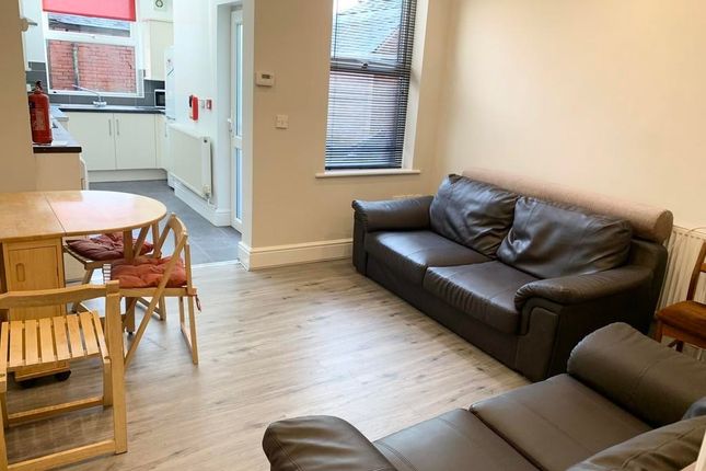Bright And Welcoming Living Room Featuring Comfort...