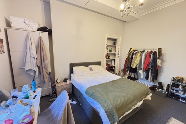 A Well-Maintained Bedroom Featuring A Comfortable ...