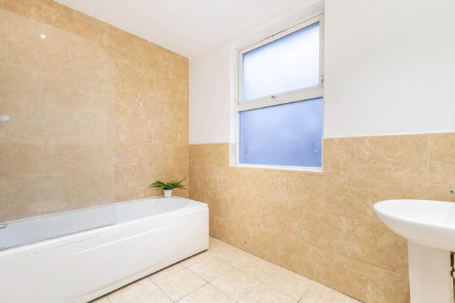 A Clean And Modern Bathroom With A Large Bathtub A...