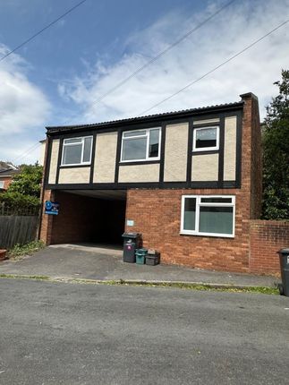 A Semi-Detached House With A Brick Lower Facade An...