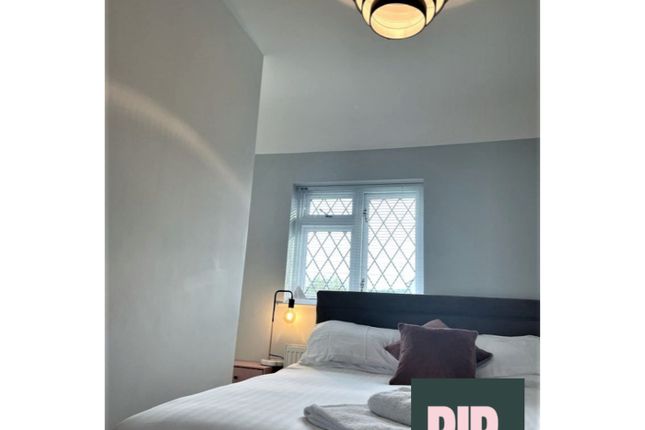 A Bright And Inviting Double Bedroom Featuring Mod...
