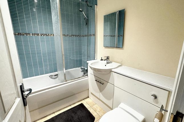 Bright And Modern Bathroom Suite Featuring A Sleek...