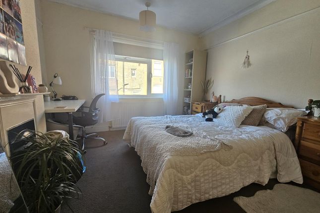 Bright And Cozy Master Bedroom Featuring A Comfort...