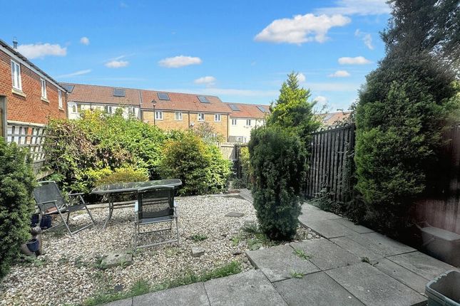 A Charming Garden Area Featuring A Paved Patio And...