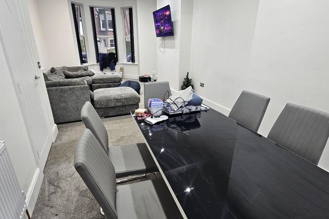 A Modern, Well-Lit Living Room Featuring Comfortab...