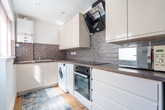 Modern Kitchen With Sleek White Cabinetry, Stainle...