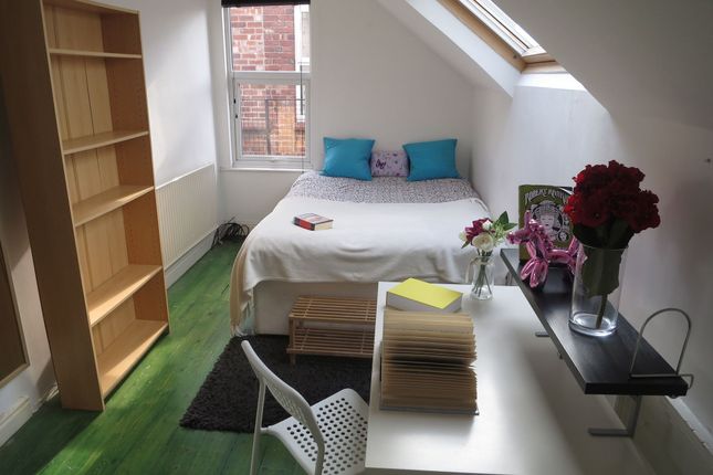 Bright And Cozy Single Bedroom Featuring A Bed Wit...