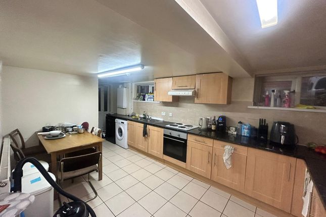 A Well-Maintained, Well-Lit Kitchen With Ample Wor...