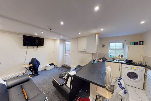 Bright And Spacious Living Room Featuring Modern F...