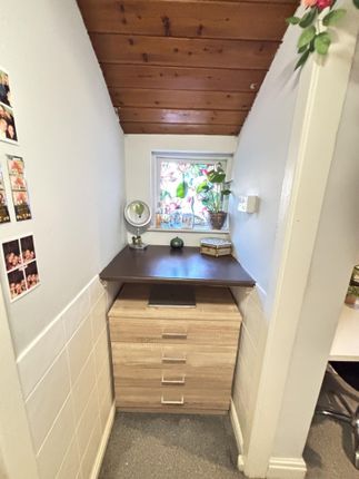 A Bright And Clean Bathroom Featuring A Window Tha...