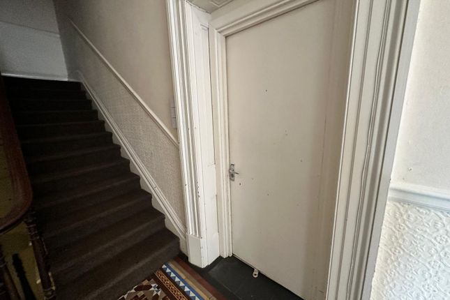 A Well-Maintained Hallway With Charming Architectu...