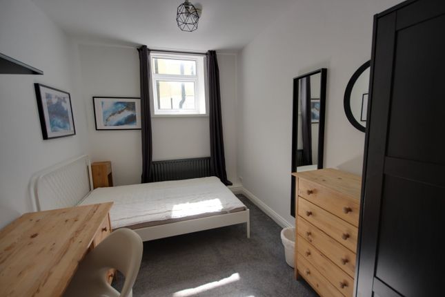 A Bright And Inviting Double Bedroom With Modern d...