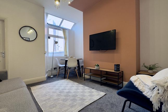 A Stylish And Inviting Living Room Perfect For Soc...