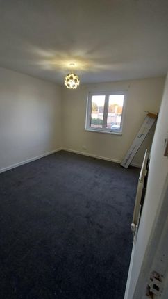 A Well-Lit, Clean Bedroom With A Single Window Pro...