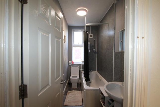 Bright And Functional Bathroom Featuring A Bathtub...