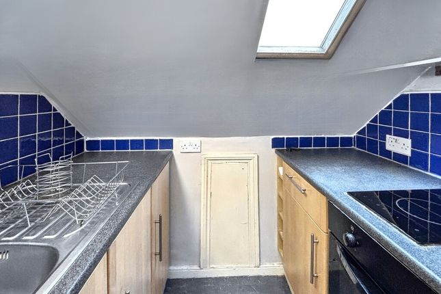 Compact Galley Kitchen With Skylight, Tiled Splash...